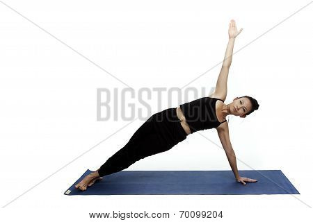 Young Beautiful Yoga Posing On A White Studio Background.