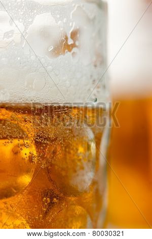 Close up of beer mug vertial with mug in background