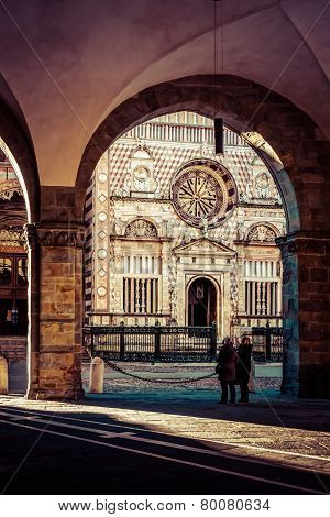 two old ladies look at the church