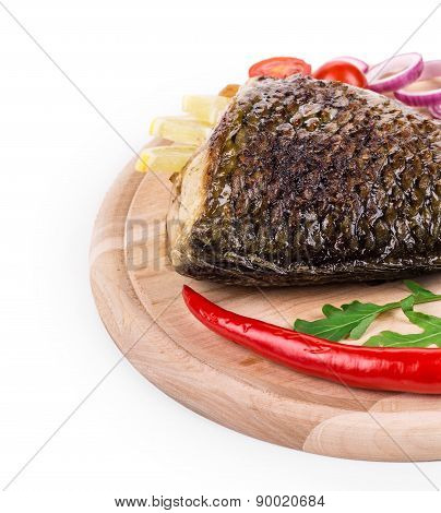 Fried carp tail with lemon and pepper.
