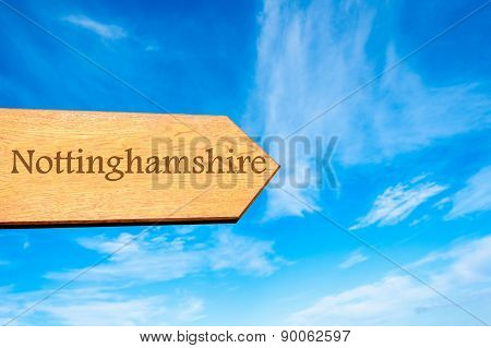 Wooden arrow sign pointing touristic destination