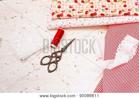 Colored Fabric Spools Of Thread And Scissors For Sewing