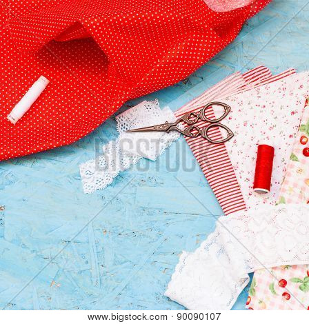 Colored Fabric Spools Of Thread And Scissors For Sewing