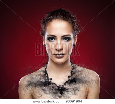 Woman's Dark Necklace Expodes Into Pieces