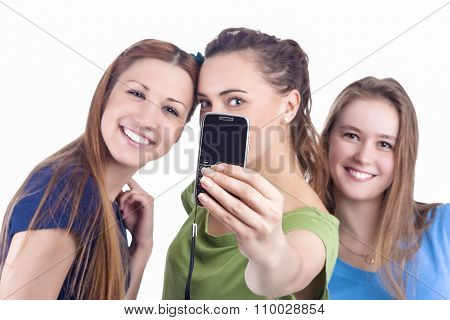 Lifestyle Concept And Ideas. Three Beautiful Caucasian Ladies Taking Selfie Photos With Smartphone.