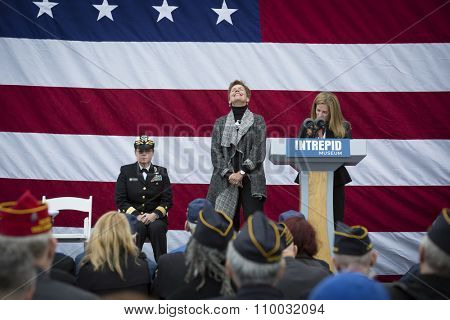 NEW YORK - NOV 25 2015: Susan Marenoff-Zausner, Pres. Intrepid Sea, Air, & Space Museum introduces Army vet Loree Sutton, Commissioner NYC Mayors Off. of Veterans Affairs at the event on Veterans Day.