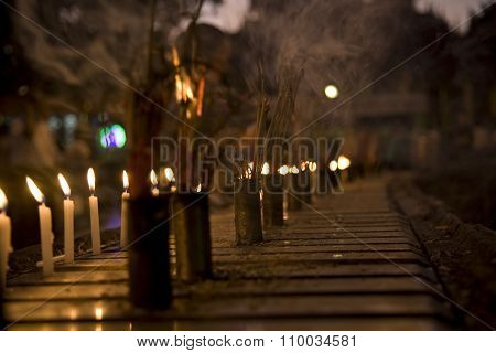 Burning Incense Sticks And Candle
