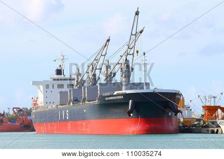 PORT LOUIS, MAURITIUS ISLAND - OCTOBER 30, 2015: Modern Bulk carrier  IVS Crimson Creek from Singapore, built 2014, size 190 x 32 m, gross tonnage 32750 t, deadweight 57945 t.