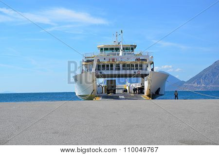 Big Ferry Boat Landing At The Shore Of Sea