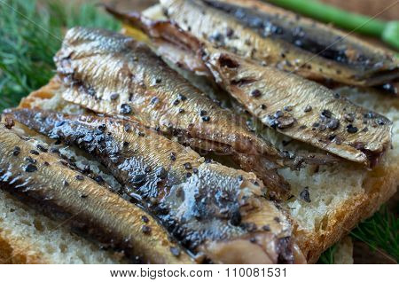 Smoked Fish On Bread In Rustic Style