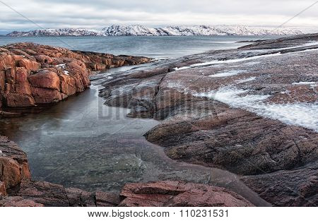 Coast Of The Arctic Ocean In The Winter On A Cloudy Day