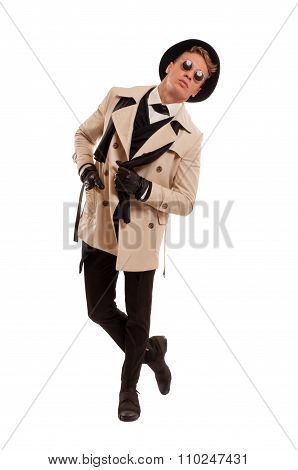 Fashion Detective Undercover Posing On A White Background.