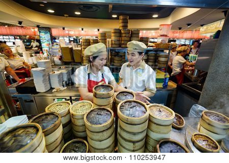 SINGAPORE - NOVEMBER 08, 2015: workers of the food court of The Shoppes at Marina Bay Sands. The Shoppes at Marina Bay Sands is one of Singapore's largest luxury shopping malls