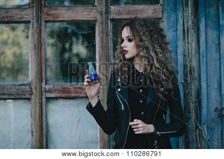 Vintage witch with elixir in hand