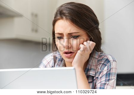 Teenage Girl Victim Of Online Bullying With Laptop