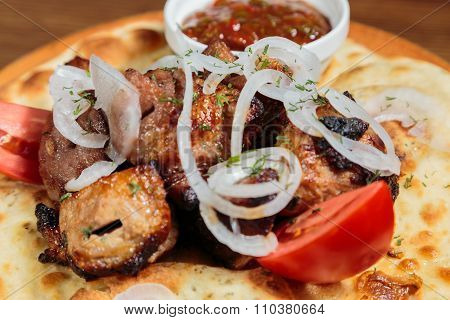 Shish kebab on bread. Tasty and healthy food, European cuisine.