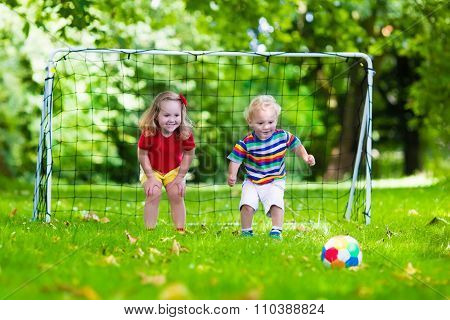Kids Playing Football In School Yard