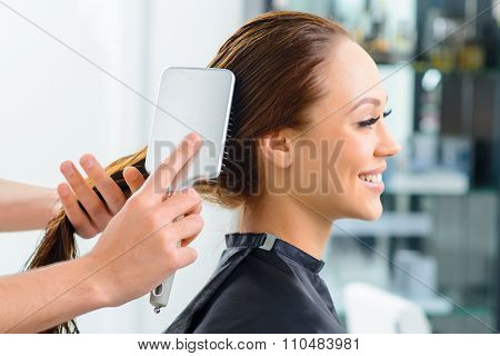 Clients hair being thoroughly brushed.
