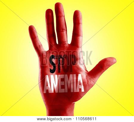 Stop Anemia written on hand with yellow background