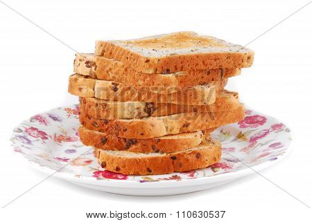 bread on plate isolated on white