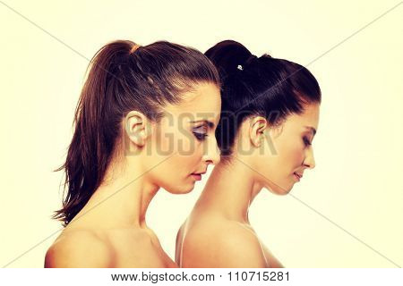 Two attractive sisters with make up.