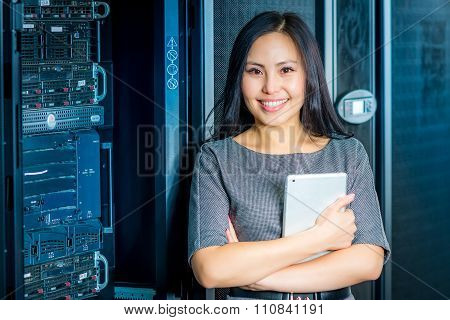 Engineer businesswoman in network server room