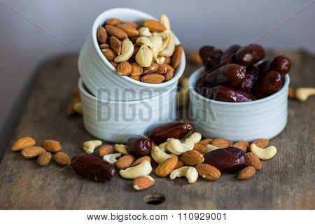 An Assortment Of Healthy Nuts In A Bowl : Almond, Cashew, Dates And Hazelnut, Making A Healthy Snack