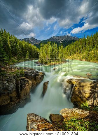 Upper Sunwapta Falls in Jasper National Park, Canada. The water originates from the Athabasca Glacier. Long exposure.
