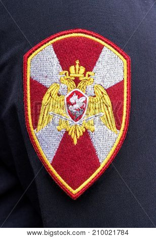 Samara Russia - September 10 2017: Chevron on the sleeve uniforms of the officer of National Guard of the Russian Federation (Rosgvardia). Russian policeman