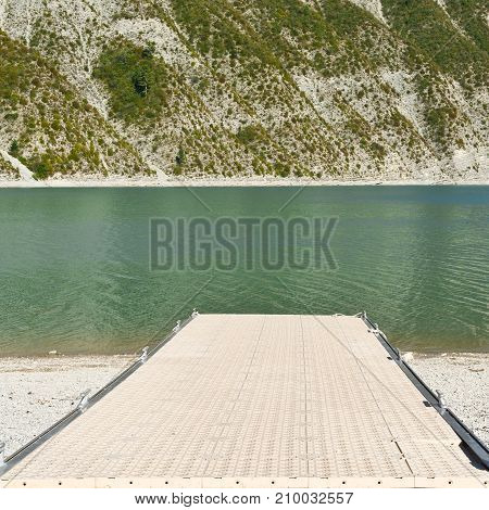 Boat launch ramp leading into the lake Castillon in France. Lake Castillon is a reservoir in Alpes-de-Haute-Provence in France.