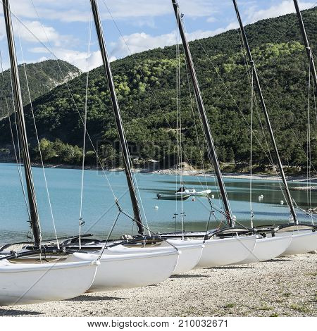 Yachts on the lake Castillon in France. Lake Castillon is a reservoir in Alpes-de-Haute-Provence in France.