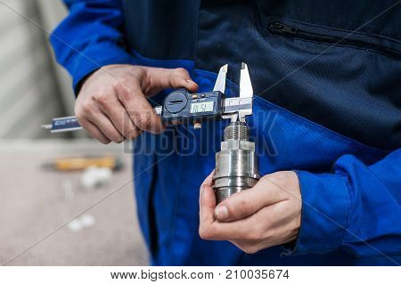 Engineer In Factory With Apprentice Checks Component Quality