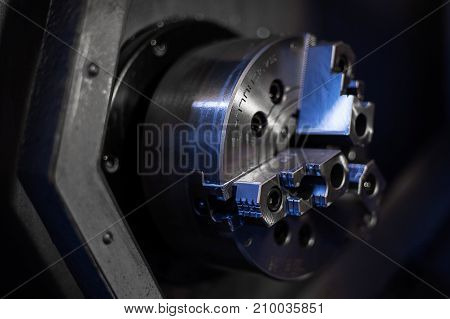 The CNC lathe machine or Turning machine drilling the metal rod with the drill tool and center drill tool .The hi-technology machining concept.