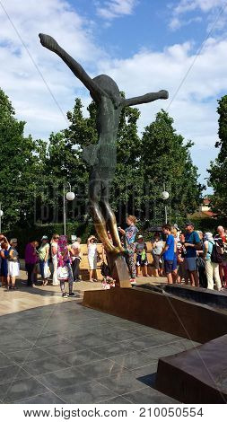 Medjugorje, Bosnia and Herzegovina - June 24, 2017: People stand in line to the figure of the Risen Christ in Medjugorje. Medjugorje the place of the apparitions of Our Lady.
