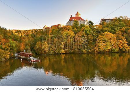 Beautiful Autumn Landscape with Veveri Castle. Natural colorful scenery with sunset. Brno dam-Czech Republic-Europe.