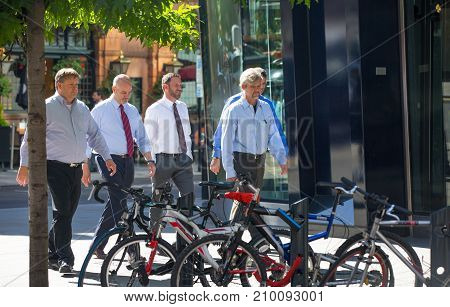 London, UK - March 15, 2017: Walking people in the City of London, Bank street.
