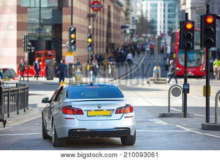 London, UK - March 15, 2017: Busy Bank street in Canary Wharf with lots of traffic and walking people