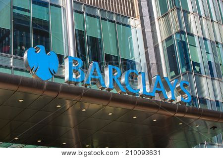 London, UK - March 15, 2017: Barclays bank sign above the main entrance to the bank building in Canary Wharf