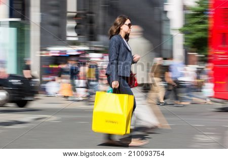 LONDON, UK - June 9, 2017: Blurred image of walking people at Oxford street, the main destination for shopping at Westend.