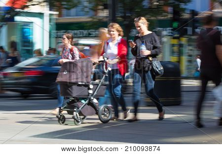 LONDON, UK - June 9, 2017: Blurred image of walking people at Oxford street, the main destination for shopping at Westend.