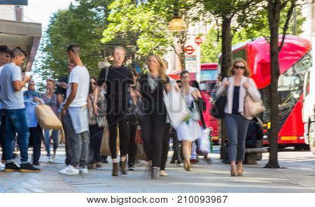 LONDON, UK - June 9, 2017: Blurred image group of walking people at Oxford street, the main destination for shopping at Westend.