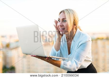Beautiful Smart Business Lady Stand On The Roof With Laptop In Hands