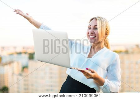 Beautiful Smart Business Lady Stand On The Roof With Laptop In Hands