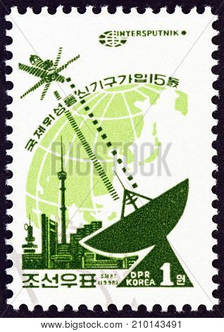 NORTH KOREA - CIRCA 1998: A stamp printed in North Korea issued for the 15th anniversary of North Korean Membership of Intersputnik shows Intersputnik, circa 1998.