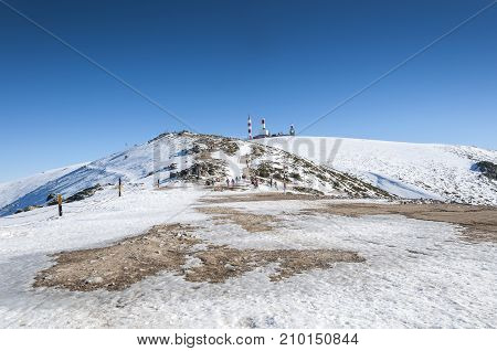 NAVACERRADA - JANUARY 4 2015: Tourists in Navacerrada Ski Resort Navacerrada Mountain Pass Madrid Spain on January 4 2015.