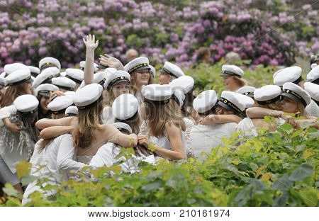 Stockholm Sweden - Jun 13 2017: Happy Teenagers Wearing Graduation Caps Hugging Each Other After Gra
