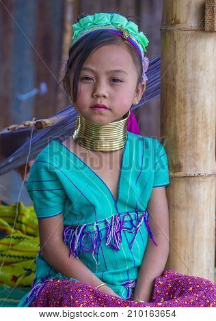 KAYAN STATE MYANMAR - SEP 09 : Portrait of Kayan tribe girl in Kayan state Myanmar on September 09 2017 Kayan tribe woman are well known for wearing neck rings.