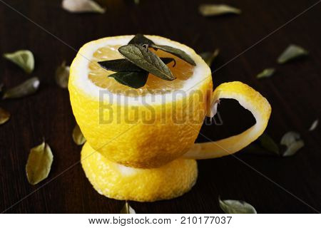 A cup of lemona cup of lemon on a wooden table