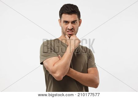Disguting! Shocked Young Man Looking At Something Unpleasant And Bad, Isolated On Gray Background. N