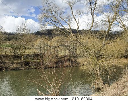 rural riparianl scenery at river Jagst in Hohenlohe a area in Southern Germany at early spring time